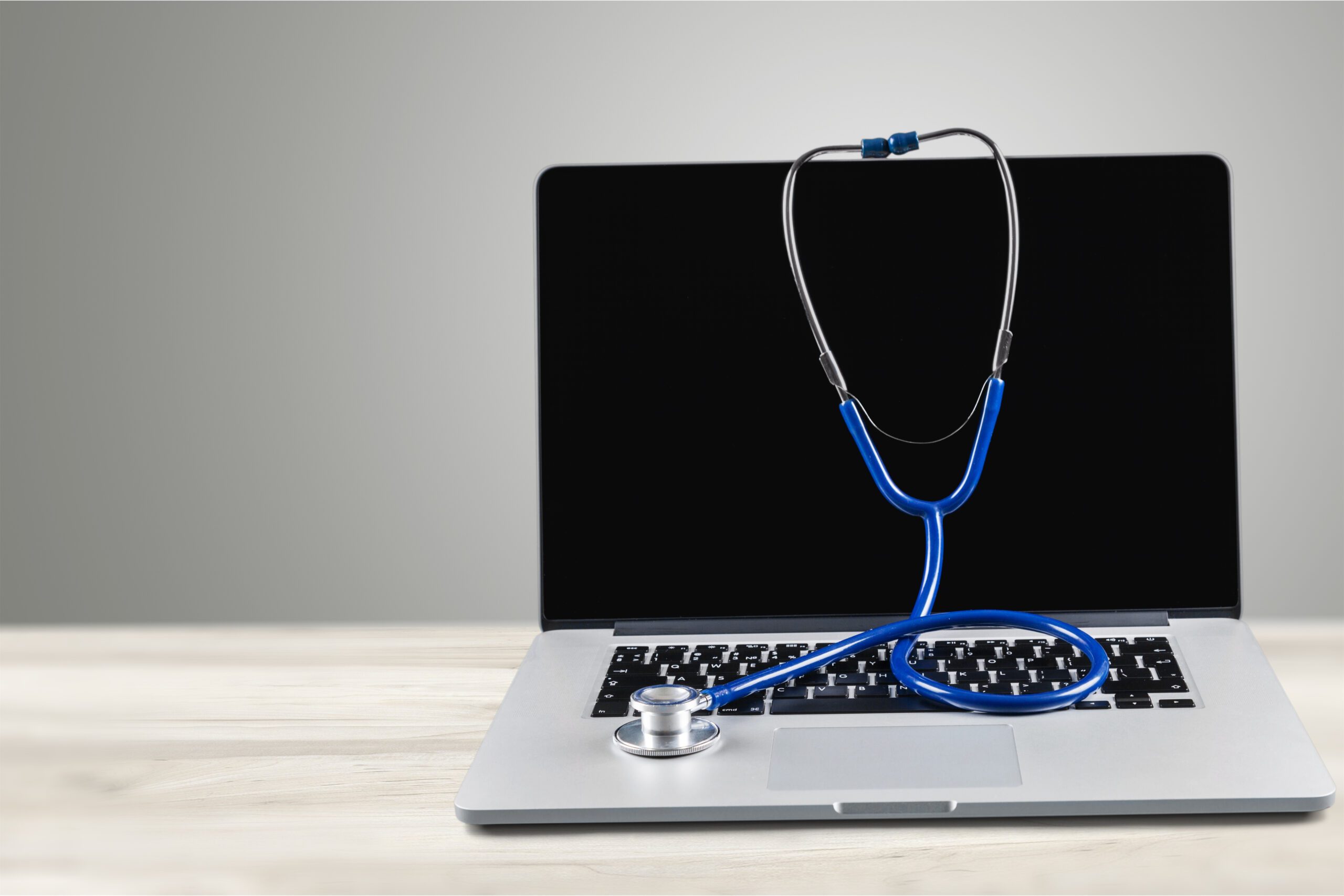 Laptop,Diagnosis,With,Stethoscope,On,Background