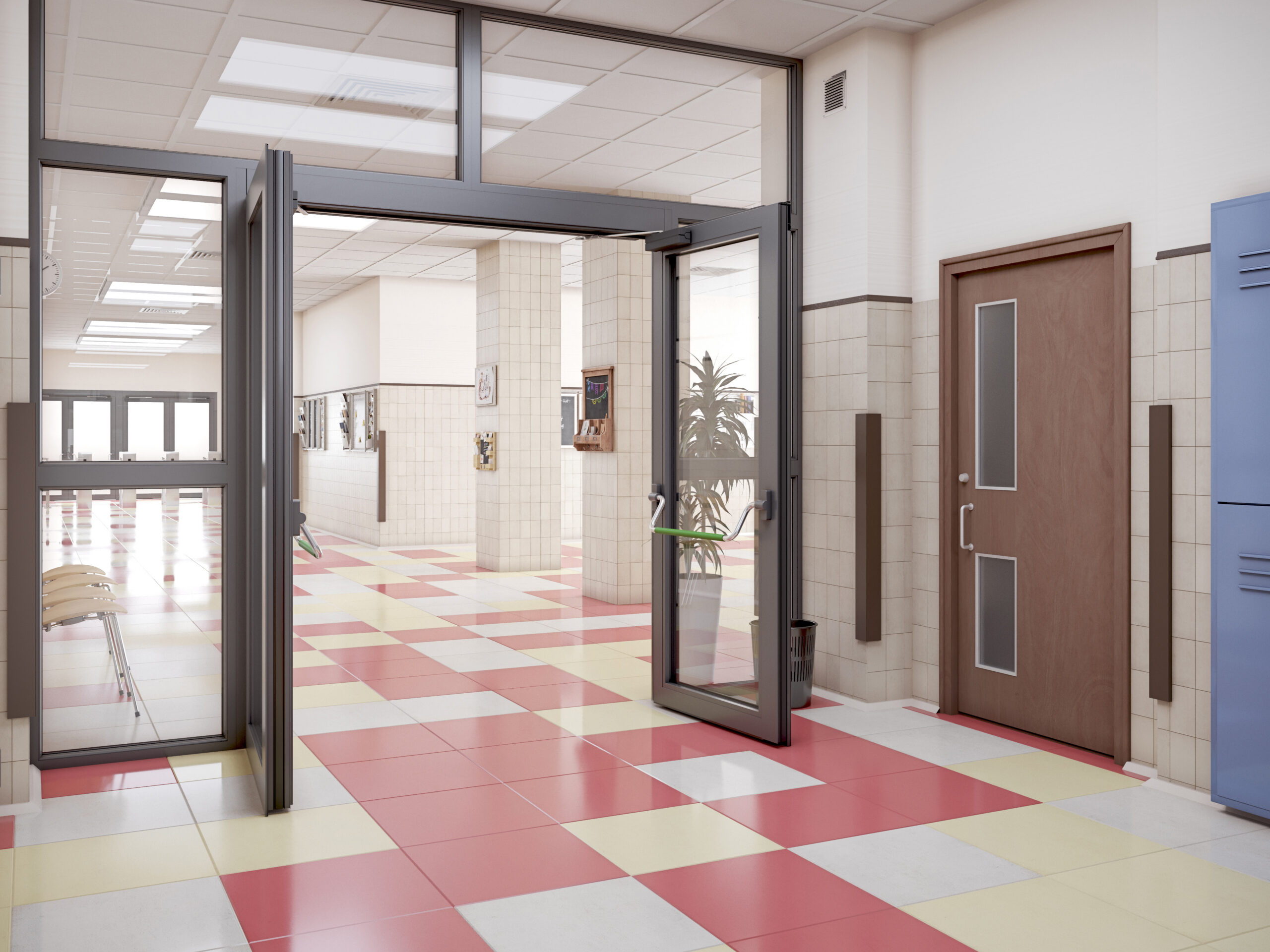 Open glass double doors lead into a school hallway with a colorful checkerboard floor in red, yellow, and white tiles.